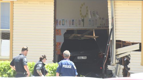 The Toyota Kluger in the classroom, where children's drawings still hang from the ceiling (Image: 9News)