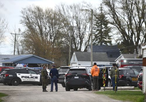 Authorities respond to the Swan Creek Boat Club after a driver crashed a vehicle through a building where a children's birthday party was taking place, Saturday, April 20, 2024, in Berlin Township, Mich.  