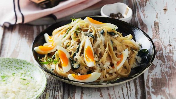 Pasta carbonara with spinach and extra egg