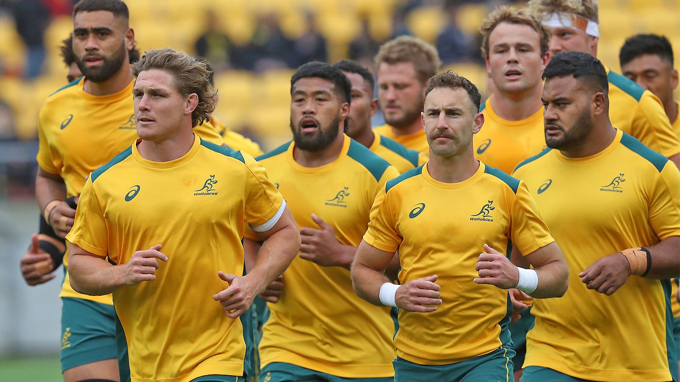 Michael Hooper of the Wallabies leads the team back