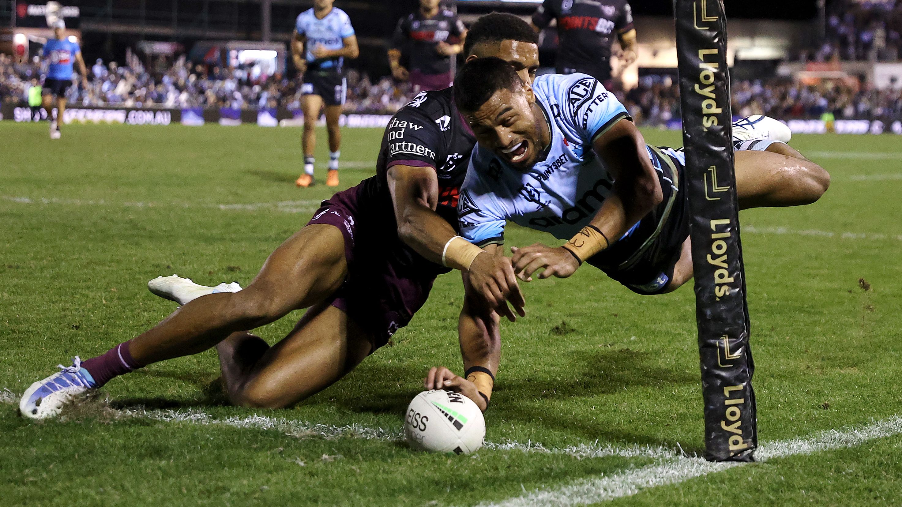 Ronaldo Mulitalo of the Sharks scores a try against Manly.