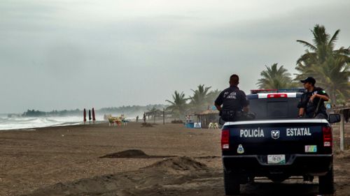 Officials monitor the coast of Colimo, Mexico. (AFP)
