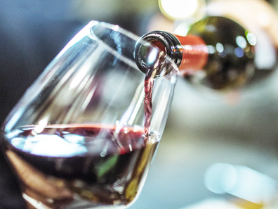 Red wine poured into a wine glass