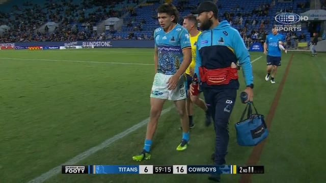 Titans youngster Jayden Campbell limps off the field.