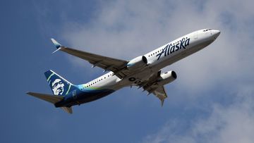 A Boeing 737-990 operated by Alaska Airlines takes off from JFK Airport.