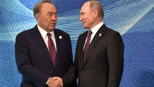 Nursultan Nazarbayev (L) shakes hands with Russian President Vladimir Putin during their meeting during the 5th Caspian summit in Aktau, the Caspian Sea port in Kazakhstan, 12 August 2018. 