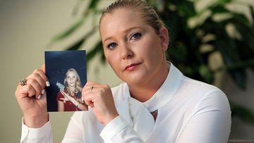 Virginia Giuffre holds a photo of herself at age 16, when she says Palm Beach multimillionaire Jeffrey Epstein began abusing her sexually.