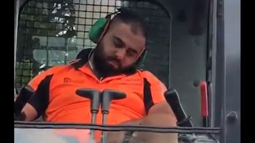 One tradie was caught apparently napping behind the controls.