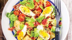 Potato salad with bacon and boiled eggs