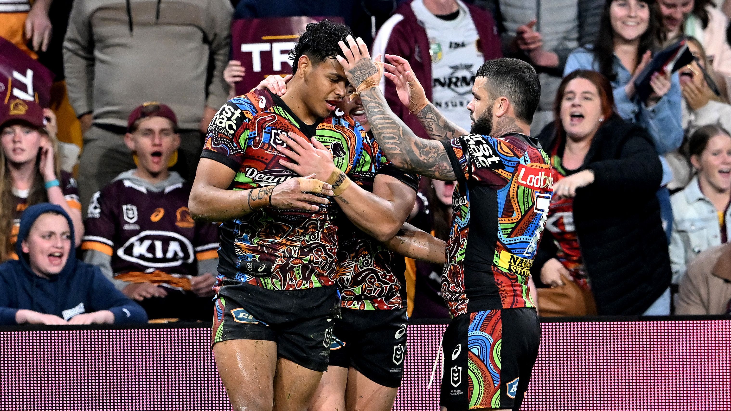 Selwyn Cobbo of the Broncos is congratulated by team mates after scoring a try during the round 22 NRL match between the Brisbane Broncos and the Newcastle Knights at Suncorp Stadium, on August 13, 2022, in Brisbane, Australia. (Photo by Bradley Kanaris/Getty Images)
