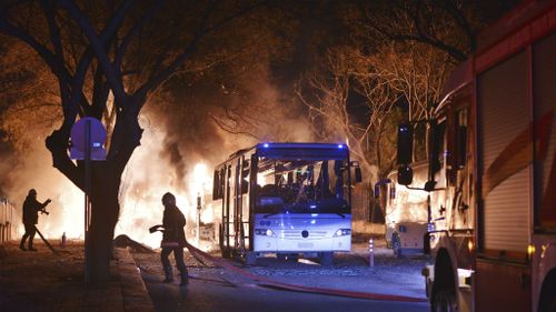 Firefighters attempt to put out a blaze after the car bomb in Ankara. (AAP)