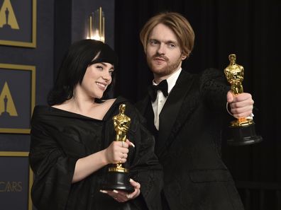 Billie Eilish, left, and Finneas, winner of the award for best original song for "No Tie To Die" from "No Time To Die", pose in the press room at the Oscars on Sunday, March 27, 2022, at the Dolby Theatre in Los Angeles. 