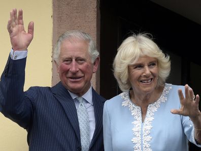 Britain's Prince Charles and Camilla, Duchess of Cornwall wave from the town hall balcony in Leipzig, Germany in 2019.