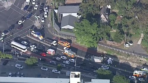 A truck has rolled over on Pittwater Road at Warringah Road, Dee Why. (9NEWS)