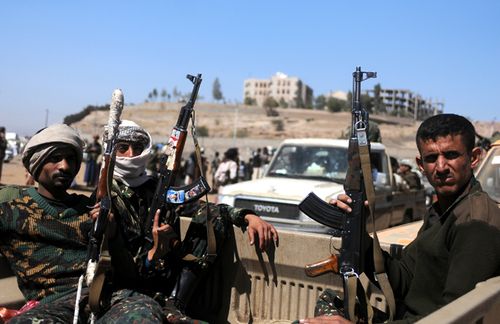 Yemeni Houthi fighters ride a vehicle to reinforce front lines where they are fighting the Saudi-led coalition. (Getty)