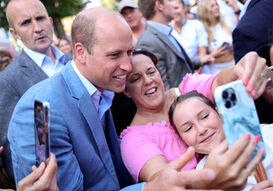 Prince William, Prince of Wales poses for selfies with members of the public as he visits Pret A Manger on September 07, 2023 in Bournemouth, England 