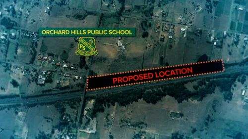 Parents are furious at the plan to bury it just 160 metres from Orchard Hills Public School.