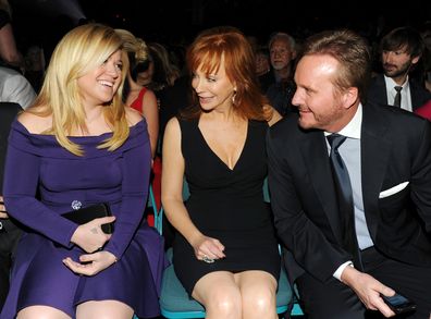 Singers Kelly Clarkson and Reba McEntire and Narvel Blackstock during the 48th Annual Academy of Country Music Awards at the MGM Grand Garden Arena on April 7, 2013 in Las Vegas, Nevada.