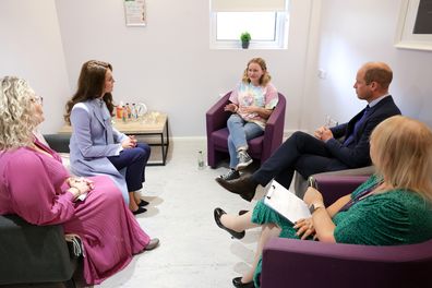 Catherine, Princess of Wales and Prince William, Prince of Wales speak with Erin Quinn, aged 24, about her personal challenges and how PIPS is supporting her to overcome these, during their visit to the PIPS (Public Initiative for Prevention of Suicide and Self Harm) charity on October 06, 2022 in Belfast, Northern Ireland 