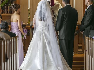 Bride and groom standing at altar during wedding ceremony divorce