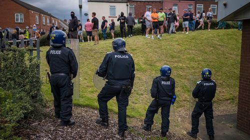 Riot police monitor a protest in Sunderland, England on August 2.