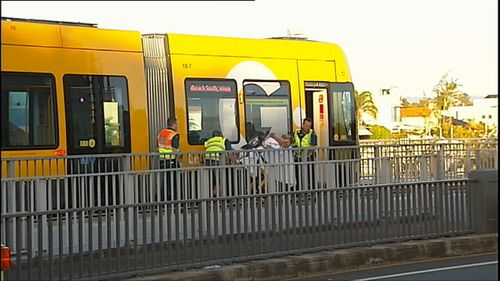 The man's legs were trapped beneath the tram after it ran over him. (9NEWS)