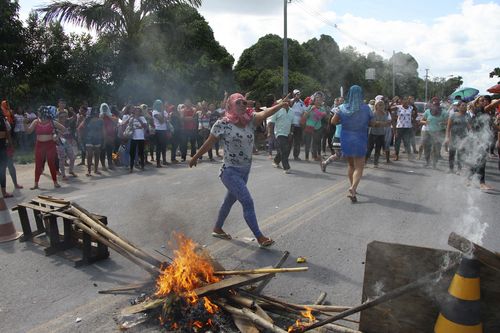 Relatives protest for more information, outside the Anisio Jobim Prison Complex where a deadly riot erupted among inmates in the northern state of Amazonas, Brazil.