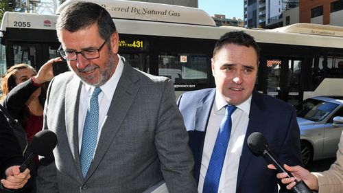 Former A Current Affair journalist Ben McCormack (centre) arrives at Downing Centre courts in Sydney. (AAP)