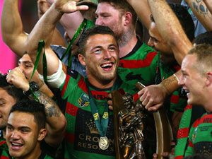 Sam Burgess celebrates with teammates after Souths grand final win. (Getty)