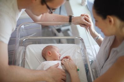 Parents of newborn baby in hospital