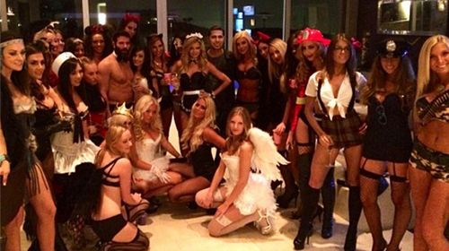 Dan Bilzerian among a group of scantily clad ladies. (Instagram)