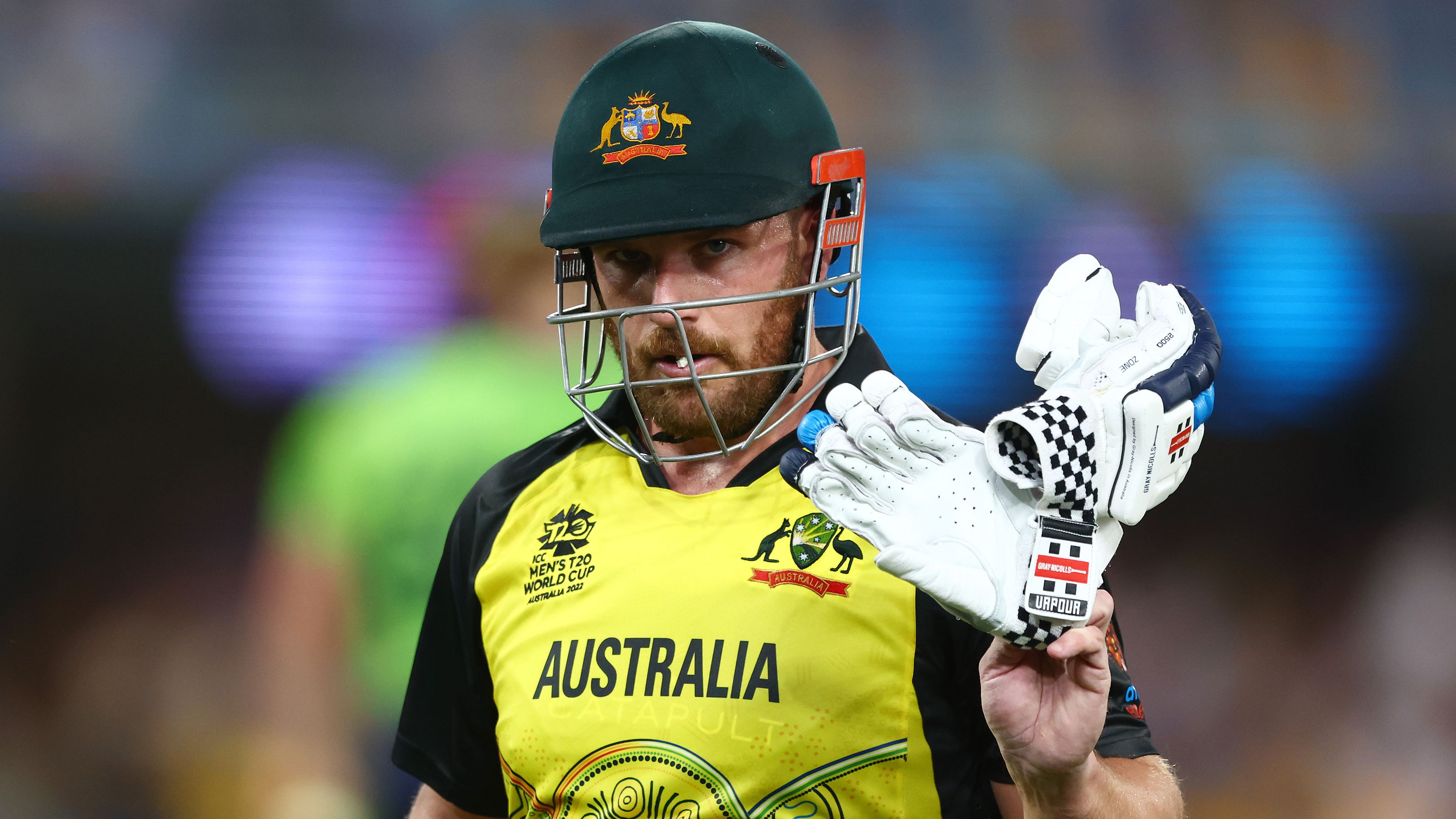 BRISBANE, AUSTRALIA - OCTOBER 31: Aaron Finch of Australia walks off the field after being dismissed by Barry McCarthy of Ireland for 63 runs during the ICC Men&#x27;s T20 World Cup match between Australia and Ireland at The Gabba on October 31, 2022 in Brisbane, Australia. (Photo by Chris Hyde-ICC/ICC via Getty Images)