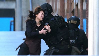 IN PICTURES: Hostages escape from Sydney siege cafe (Gallery)