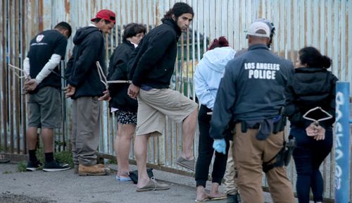 Police in Los Angeles detain suspected gang members. (AP).