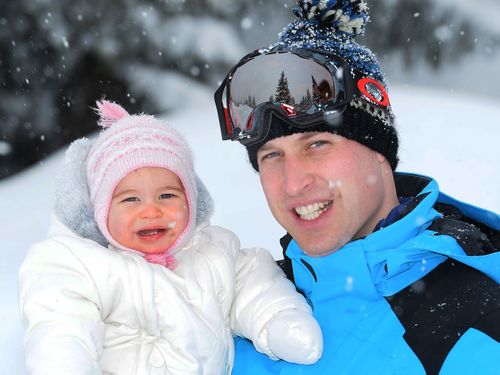 Prince William and Princess Charlotte on the family's first snow holiday. (AAP)