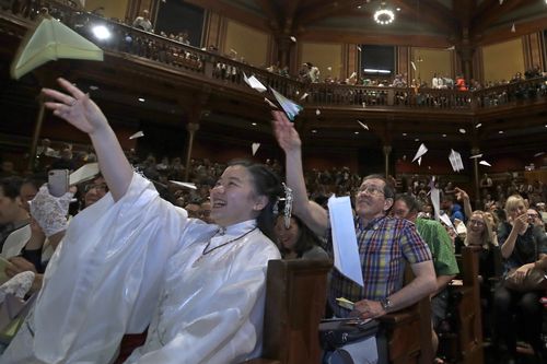  In this September 12, 2019 file photo, audience members toss paper airplanes at the 29th annual Ig Nobel awards ceremony at Harvard University, in Cambridge. (AP Photo/Elise Amendola, File)