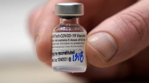 A vial of the Pfizer vaccine for COVID-19 is shown, Sunday, Jan. 24, 2021, at a one-day vaccination clinic set up in an Amazon.com facility in Seattle and operated by Virginia Mason Franciscan Health. (AP Photo/Ted S. Warren)