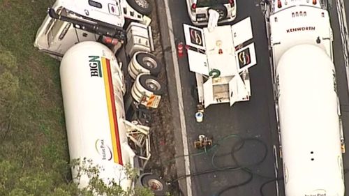 Exclusion zone in place after truck carrying chemicals rolled west of the Gold Coast