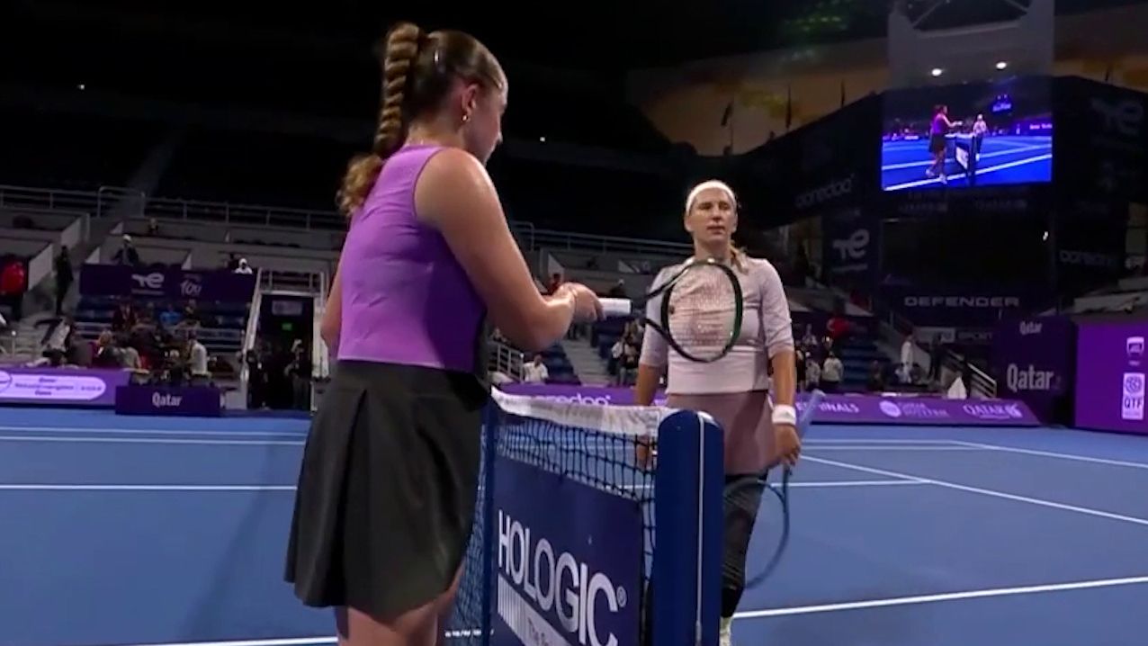 Jelena Ostapenko (left) raises her racquet after being defeated by Victoria Ostapenko.