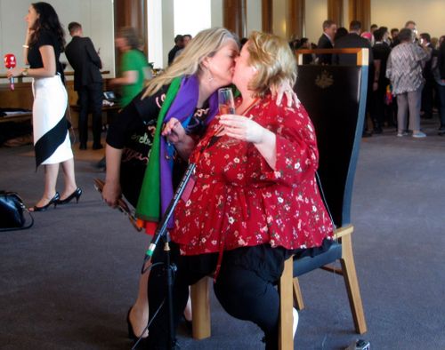 Australian Senator Louise Pratt kisses Magda Szubanski following the passing of marriage equality legislation in the Lower House (AAP)