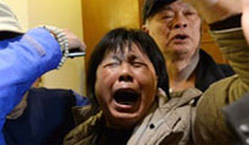 Grieving families of MH370 passengers (supplied)