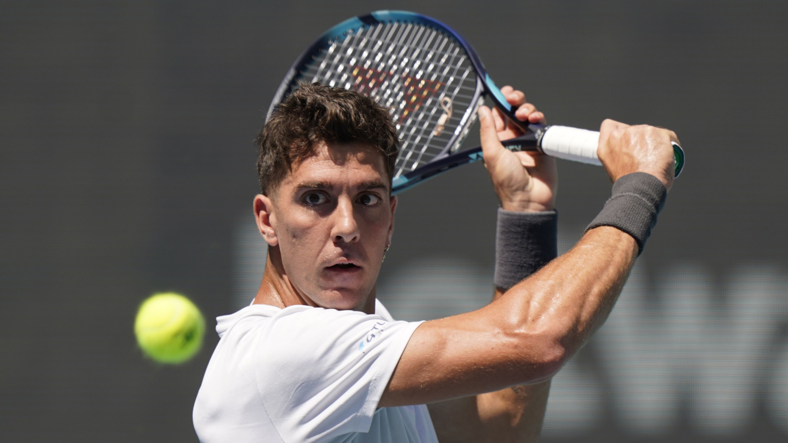 Thanasi Kokkinakis returns a shot at the Miami Open.