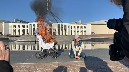 A climate protest has ramped up outside Parliament House following a climate change report.