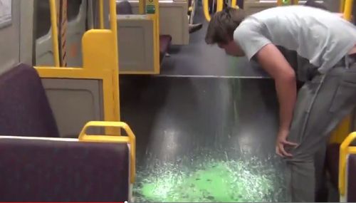 The vomit prank was one of several that saw Adrian Van Oyen banned from Queensland trains for life. (YouTube)