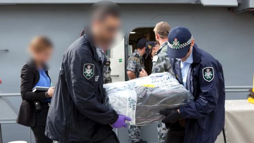 AFP unload packages of cocaine after intercepting a yacht in 2017 that was destined for Australia's east coast.