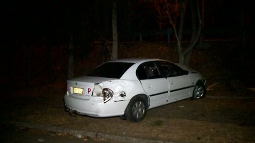 The smashed Holden Commodore was found in Milperra in Sydney's south-west. (9NEWS)