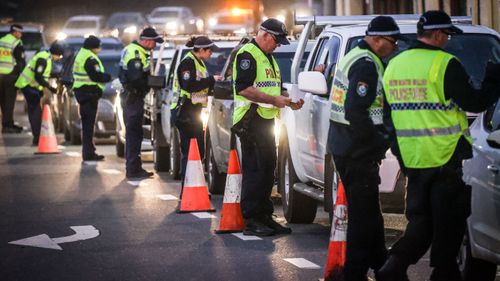 Police at checkpoint in Albury on the NSW-Victoria border on July 8.