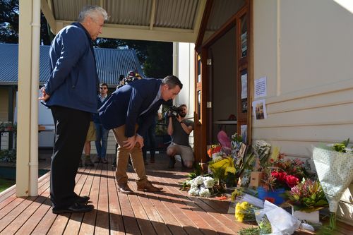 A memorial continues to grow near the property for the six victims. 