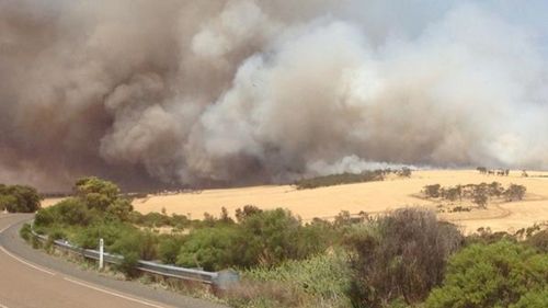 Flames hunt down a home in Nantawarra. (Les Pearson, Plains Producer)