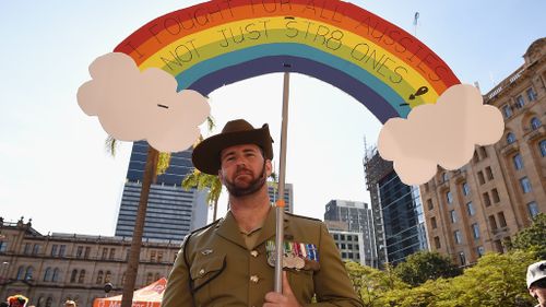 Beau Best poses for a photo during a Same-Sex Marriage march at Queen Gardens in Brisbane, yesterday. (AAP)